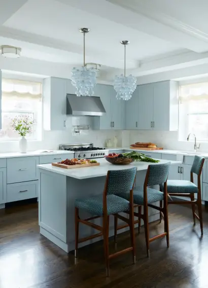 Renovated kitchen with a pale blue island