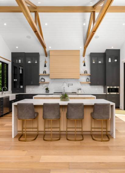 Renovated kitchen with an island and wood beams